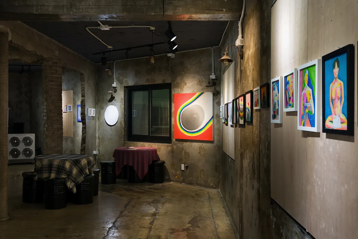 Installation view — long wall with a row of framed paintings